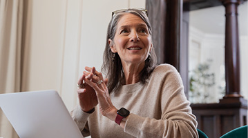 woman sitting in front of a laptop